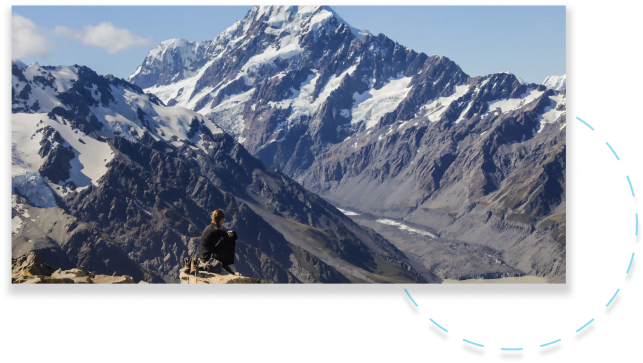 a person looking at mountains